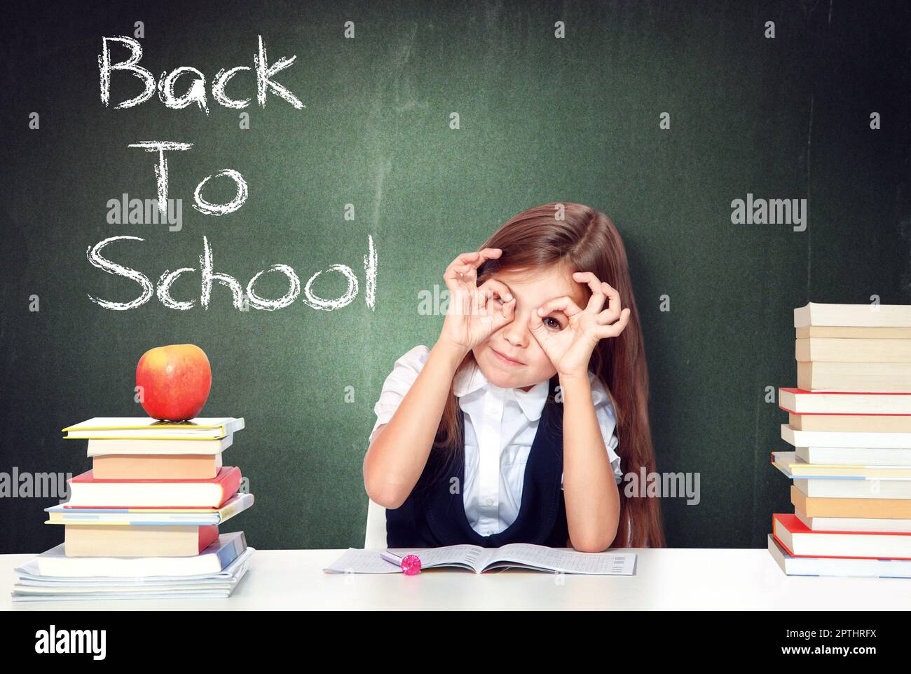 Laughing school girl reading hi-res stock photography and images - Alamy