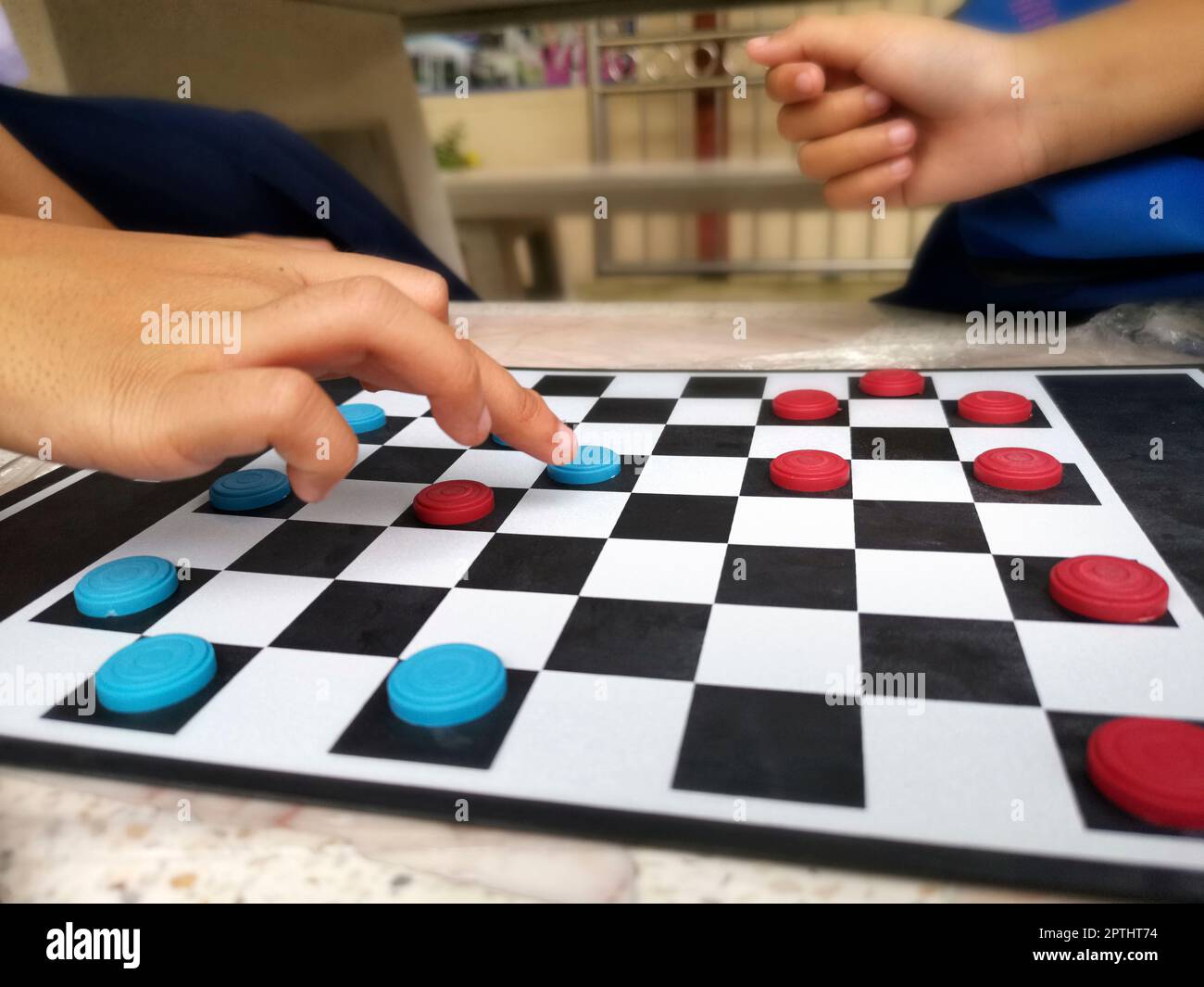 People are playing checkers close-up, the concept of a board game 