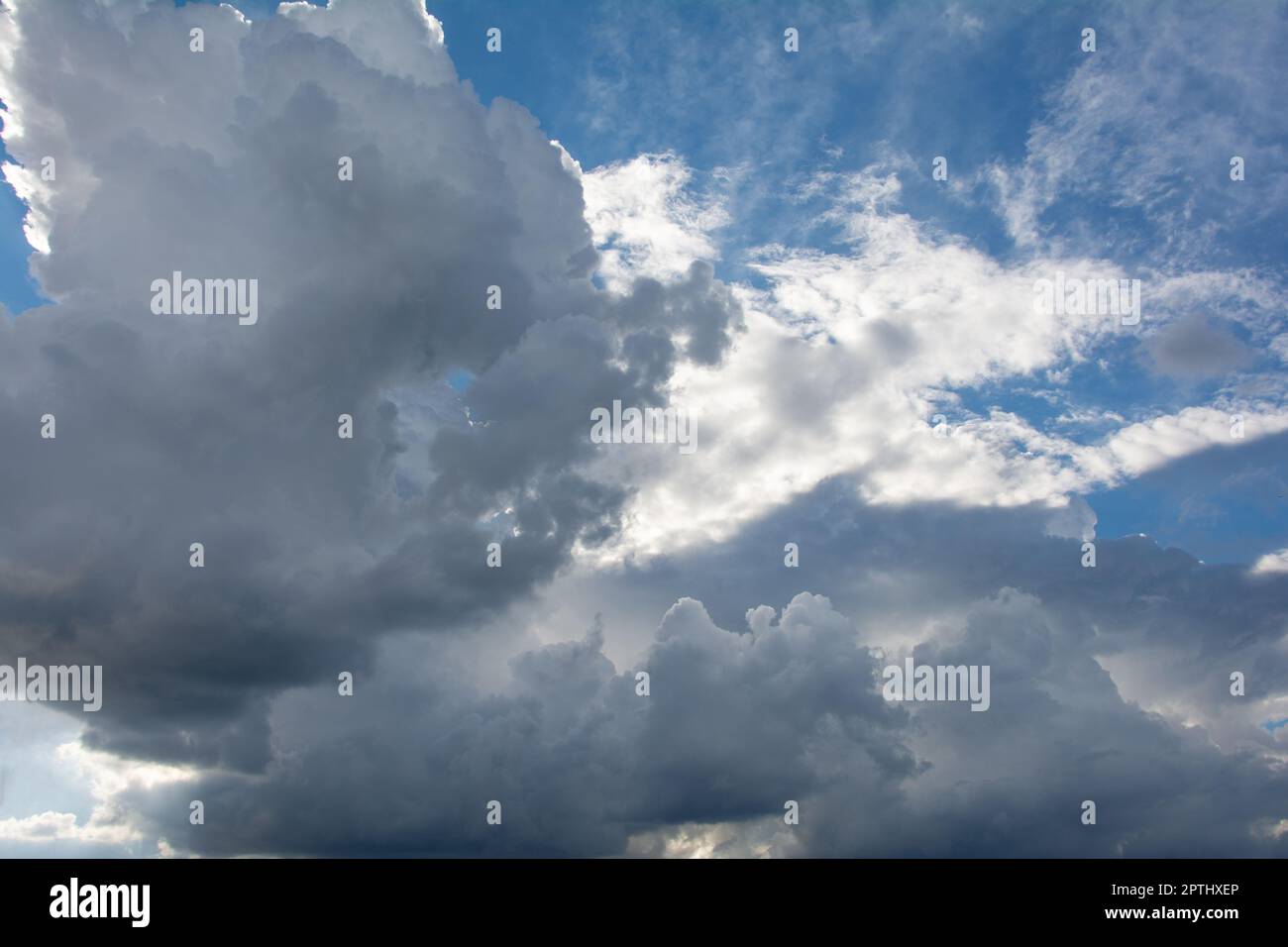 Bright and Dark clouds on the blue sky Stock Photo