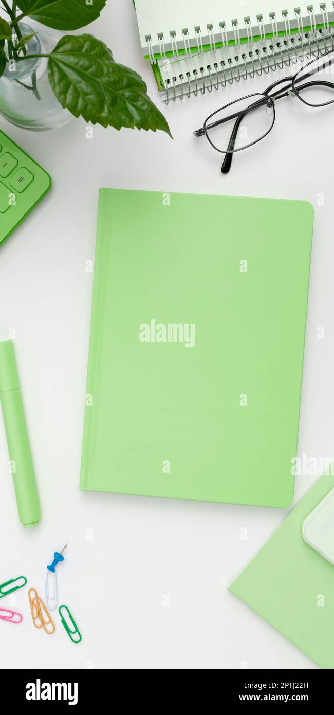 Office Supplies Over Desk With Keyboard And Glasses And Coffee Cup For