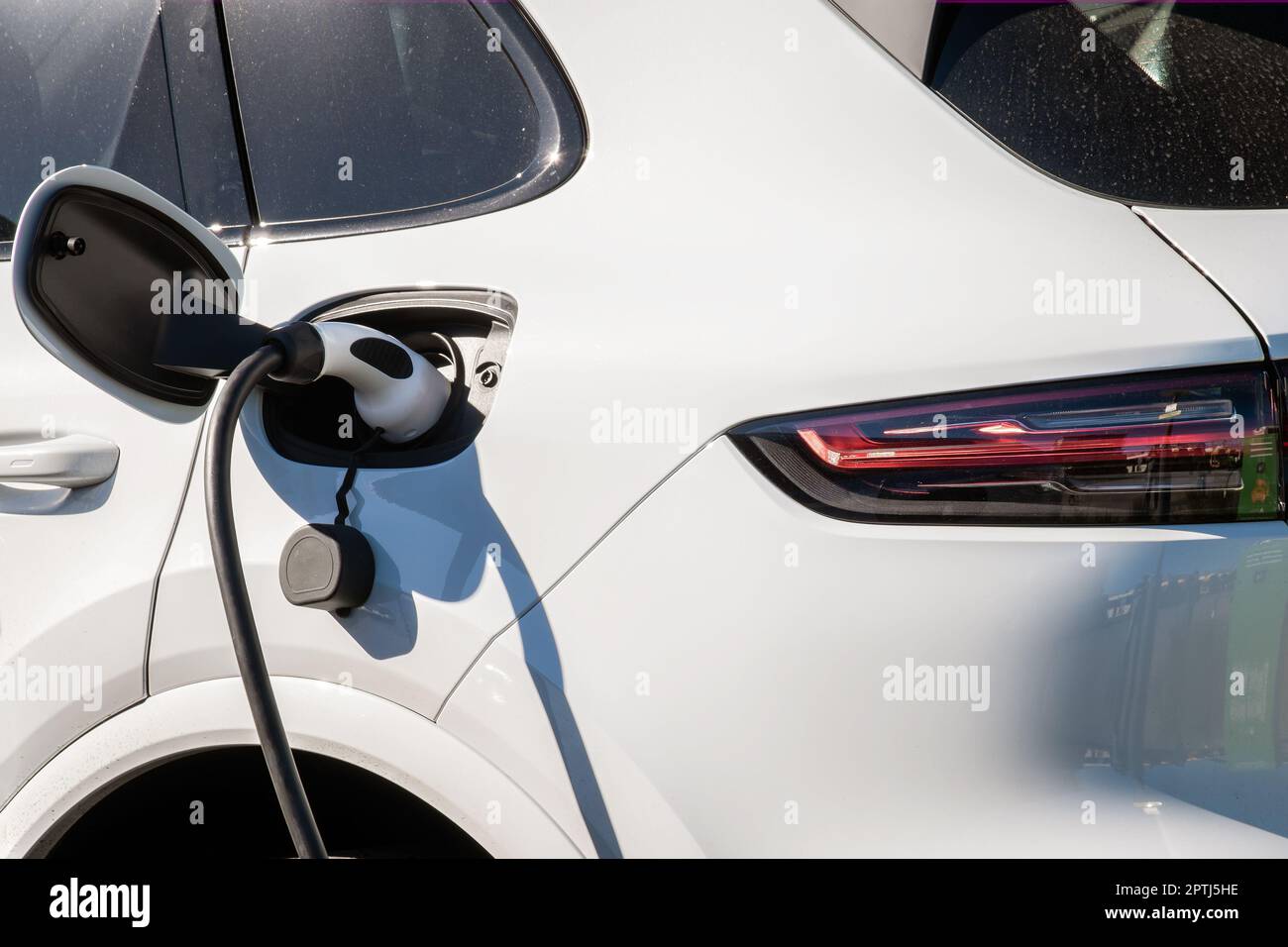 Electric Car Connected To Ev Charging Station With Ev Charging Cable