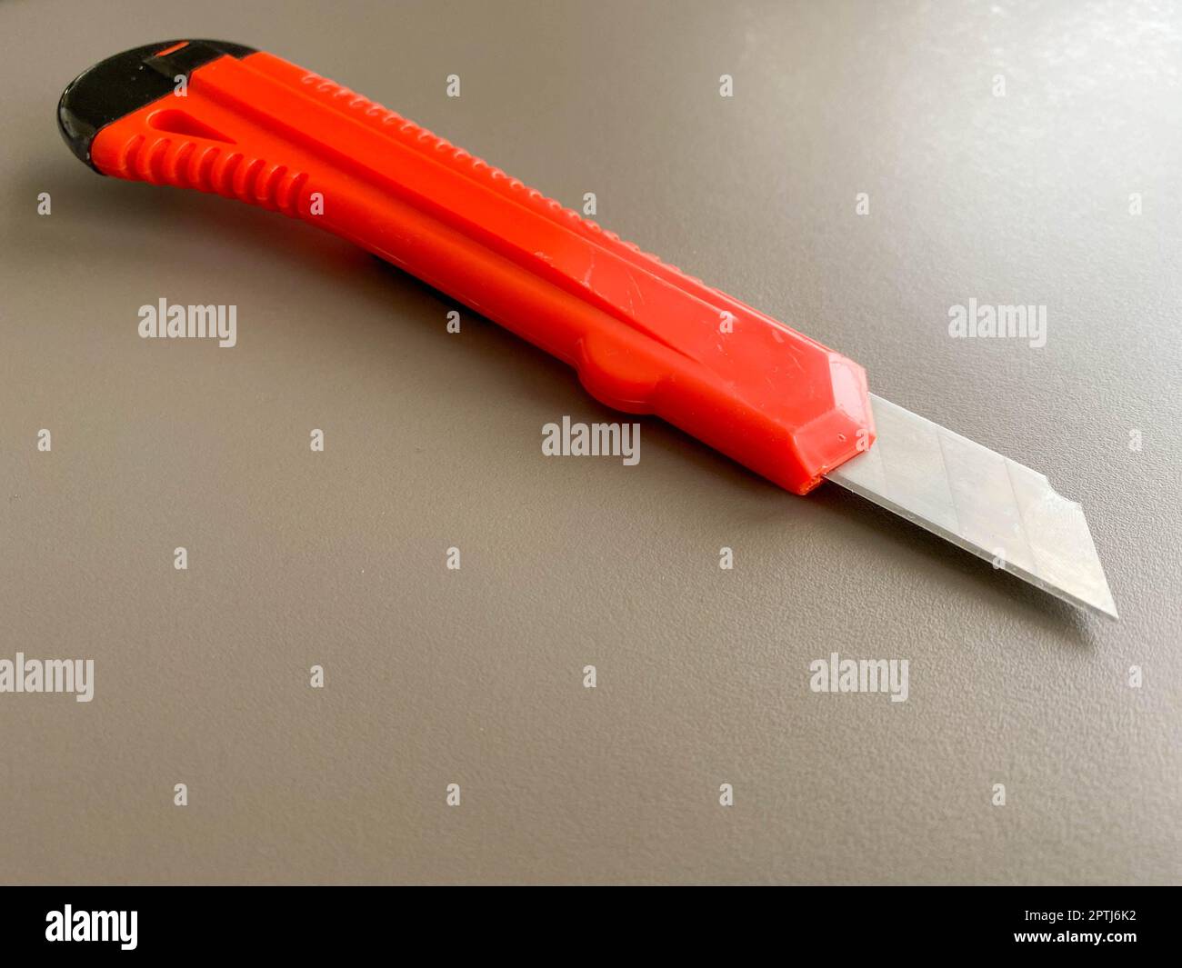 A Red Knife With The Blade Protected By A Plastic Cover Stock Photo,  Picture and Royalty Free Image. Image 102869035.