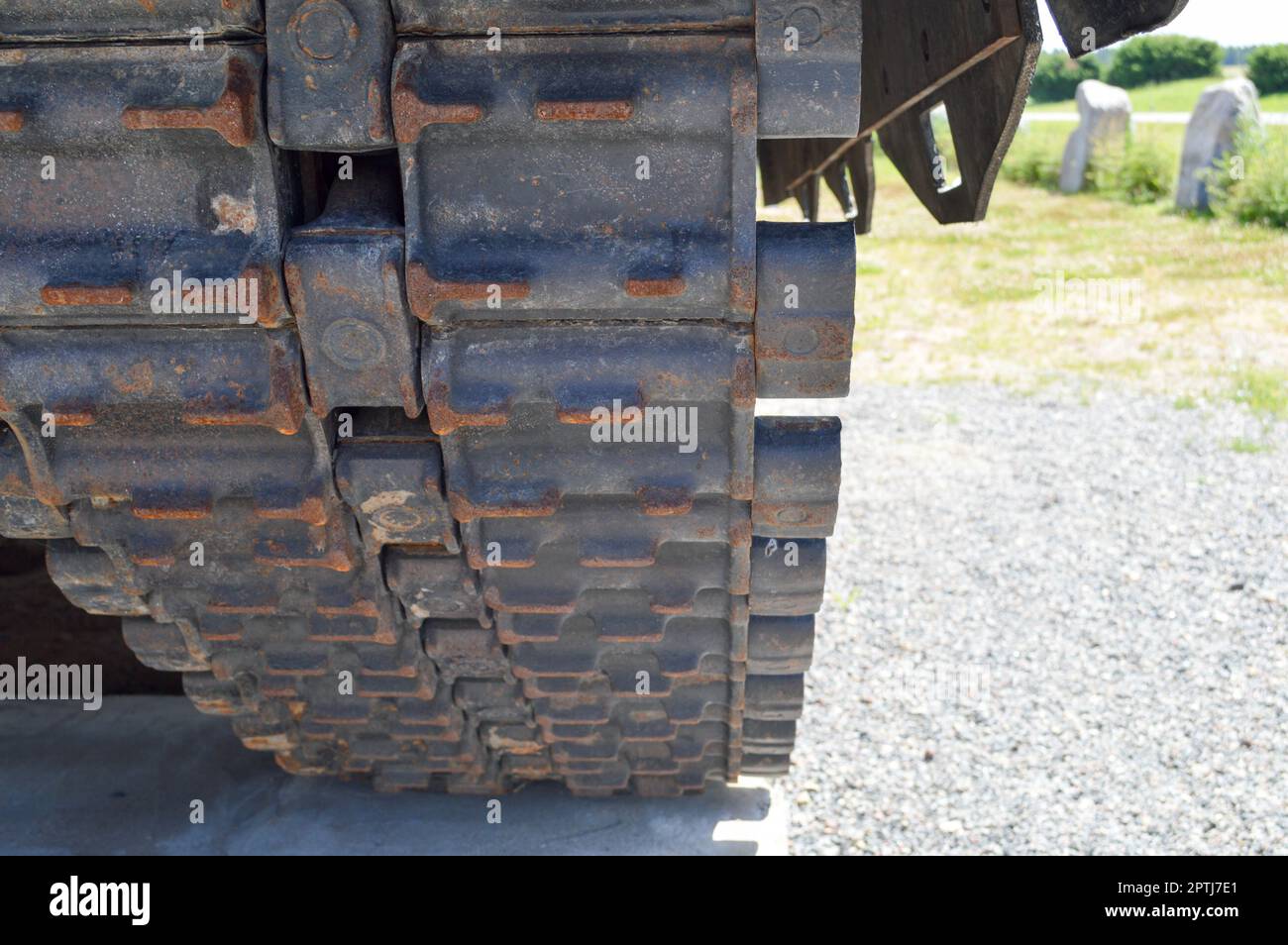 Rusty iron dirty metal heavy track caterpillar of a large green military off-road armored deadly dangerous Russian Syrian battle tank and bottom. Stock Photo