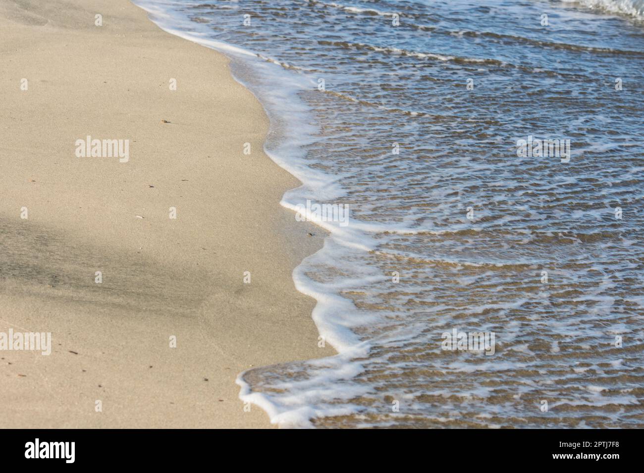 half water with foam and fine sandy beach in egypt Stock Photo