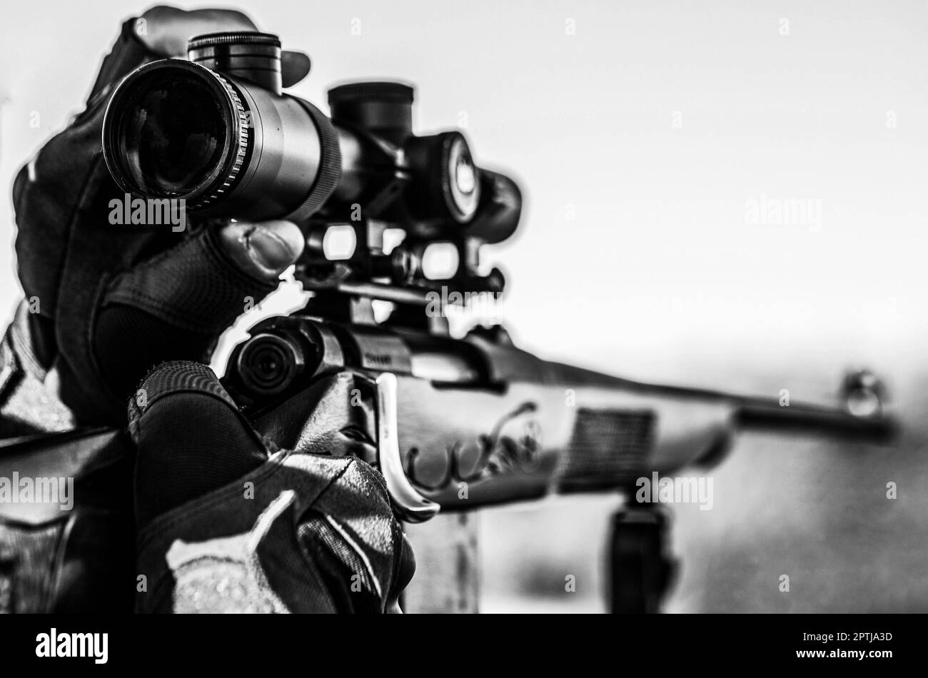 Shooter sighting in the target. Hunter with hunting gun and hunting