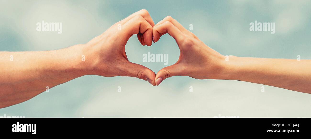 Love, friendship concept. Girl and male hand in heart form love blue ...