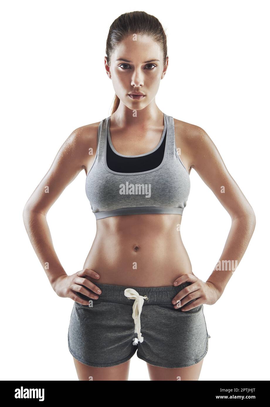 Ill reach my fitness goals. Cropped portrait of a young female athlete  standing arms akimbo against white background Stock Photo - Alamy