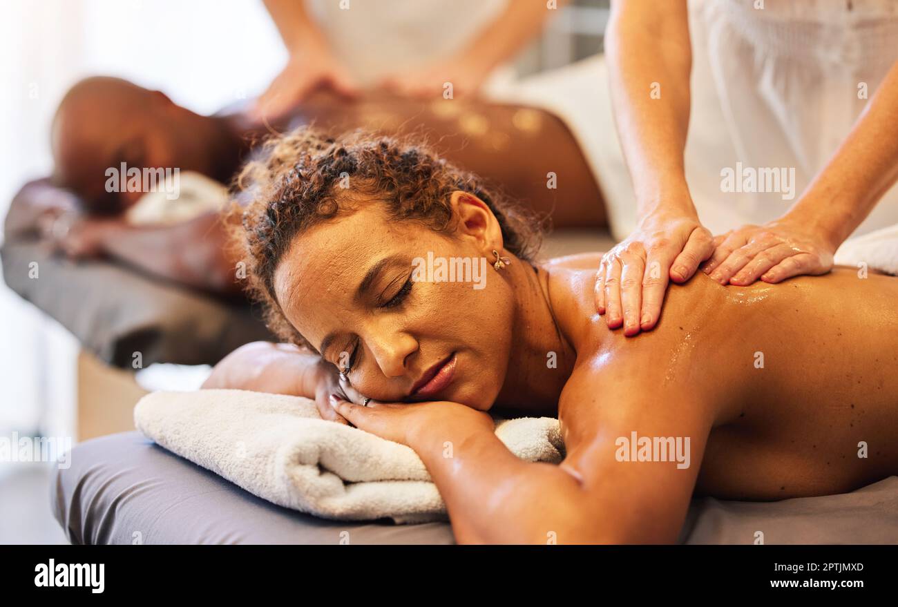Black couple massage, spa and relax with oil on vacation, holiday or  retreat together for bonding, honeymoon or calm. Black woman, man or couple  in ma Stock Photo - Alamy