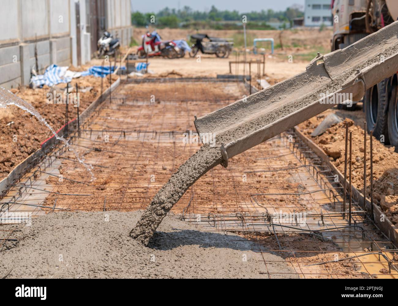 Pouring readymixed concrete after placing steel reinforcement to make