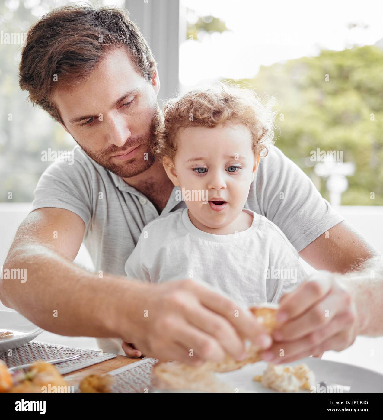 Feeding, lunch and child eating bread with father and hungry together