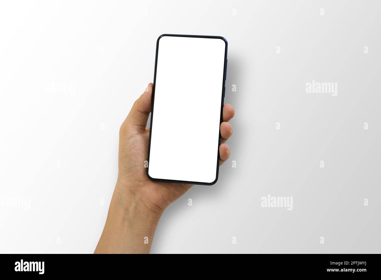 Close up of hand holding smartphone with white screen, Isolated on white background. Stock Photo