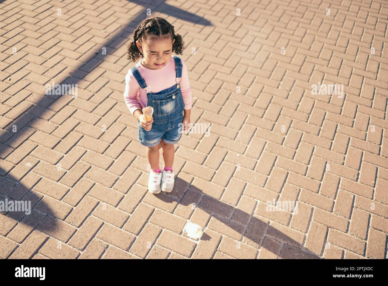 Crying kid drop ice cream on floor, ground and street in summer ...