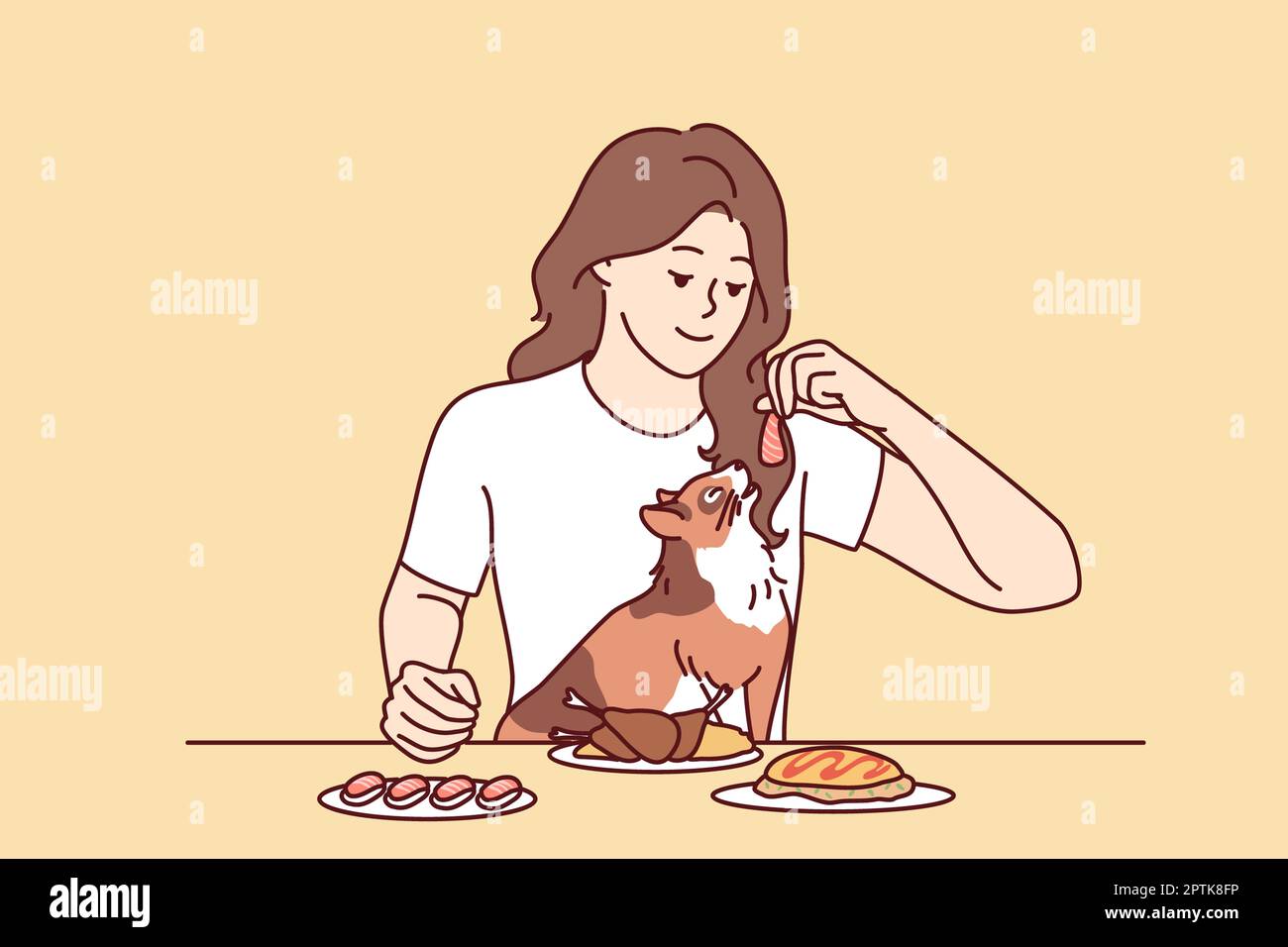 Smiling young woman feeding cat with food from table. Happy girl give