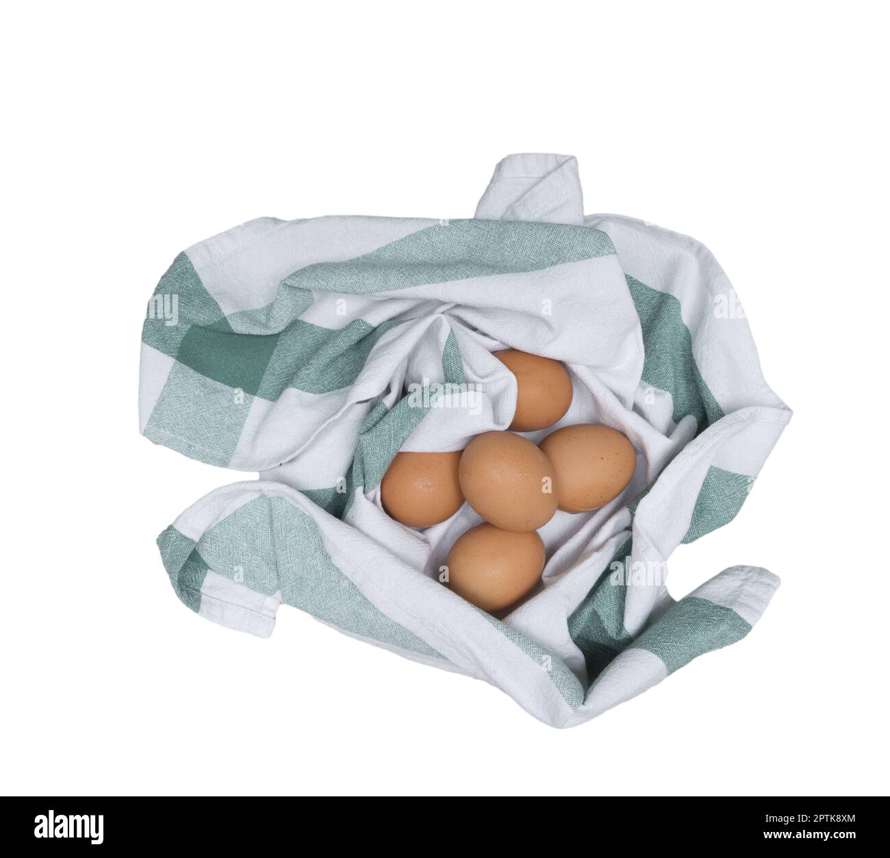 some eggs in a rag on the wooden table in the kitchen on a transparent ...