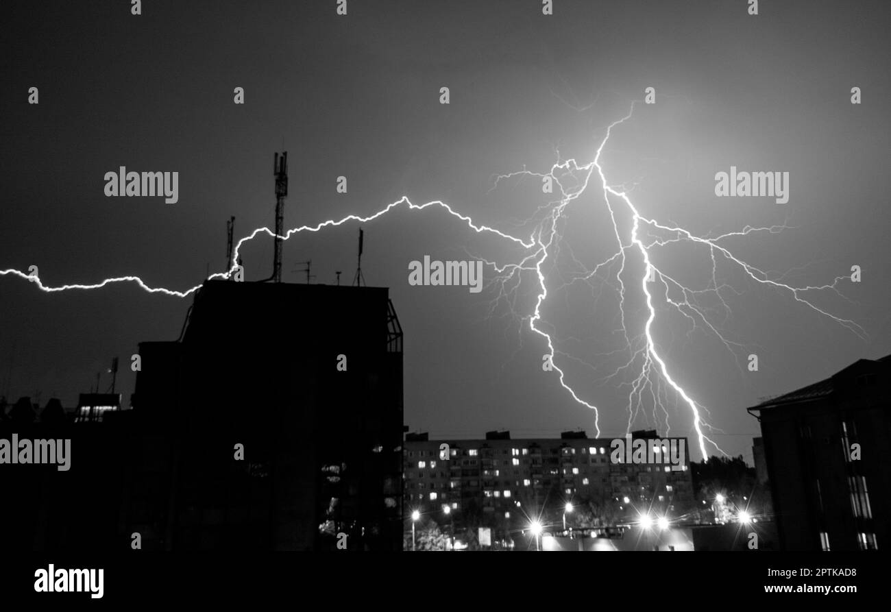beautiful big lightning during a thunderstorm in the city Stock Photo