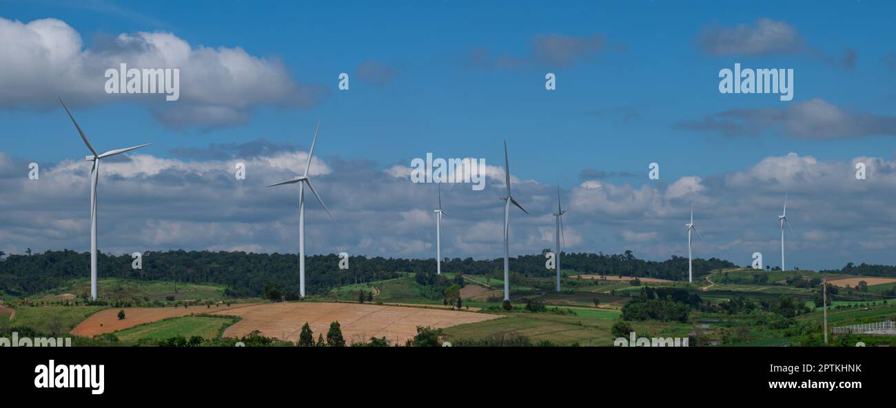 Landscape of wind turbines on hills with blue sky background. Renewable ...