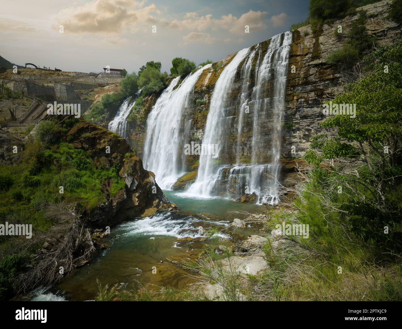 Beautiful waterfall summer season. Tortum Waterfall morning view. Uzundere, Erzurum, Türkiye Stock Photo