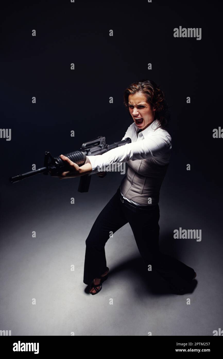 Woman pointing rifle at worker hi-res stock photography and images - Alamy