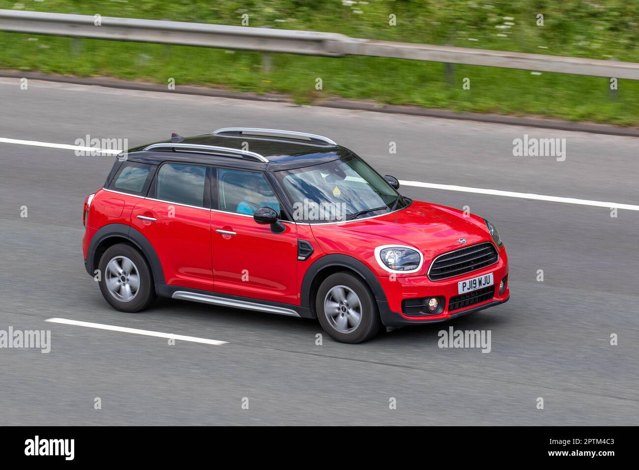 2019 Red Mini Countryman Cooper Classic Auto 136 Steptronic Auto Start/Stop Red Car SUV Petrol 1499 cc; travelling on the M61 motorway, UK Stock Photo