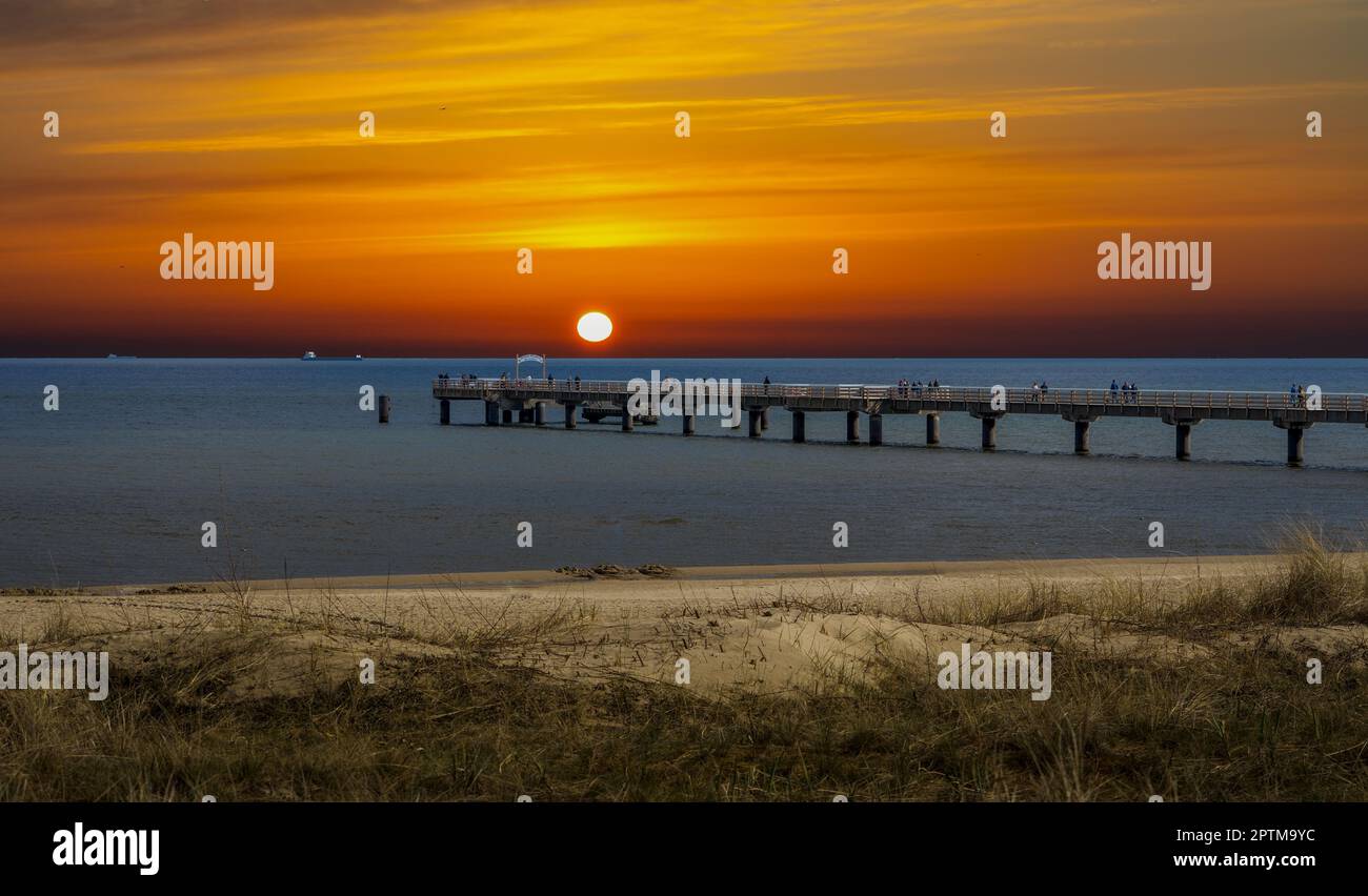 sunset over the baltic sea with bridge Stock Photo