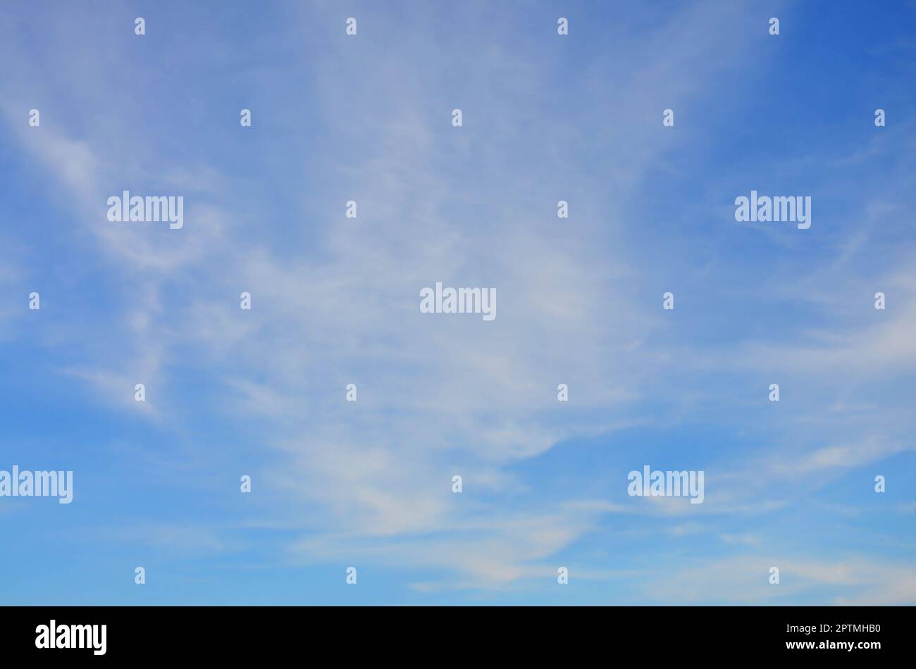 Heavenly space of blue color with a lot of thick white clouds ...