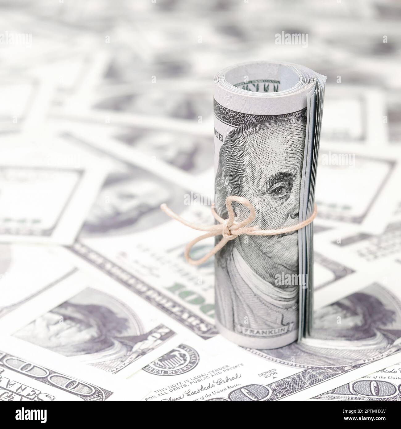 US dollars rolled up and tightened with band lies on a lot of american