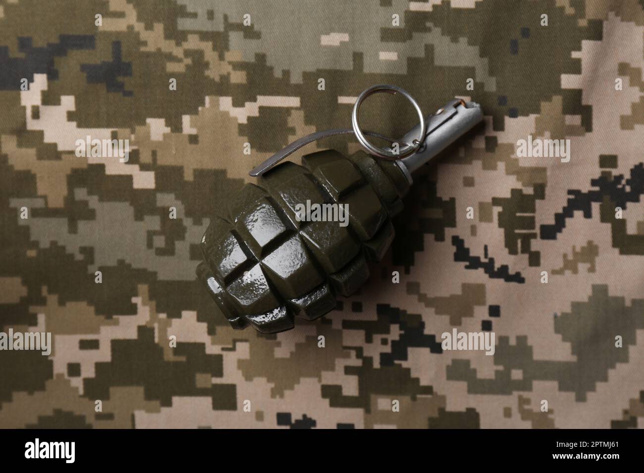 Hand grenade on digital camouflage fabric, top view Stock Photo Alamy
