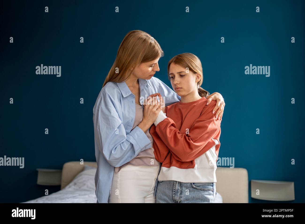 Loving young adult daughter makes an unexpected surprise to her mature  attractive mom, gives her a gift. Friendship of mom and daughter Stock  Photo - Alamy