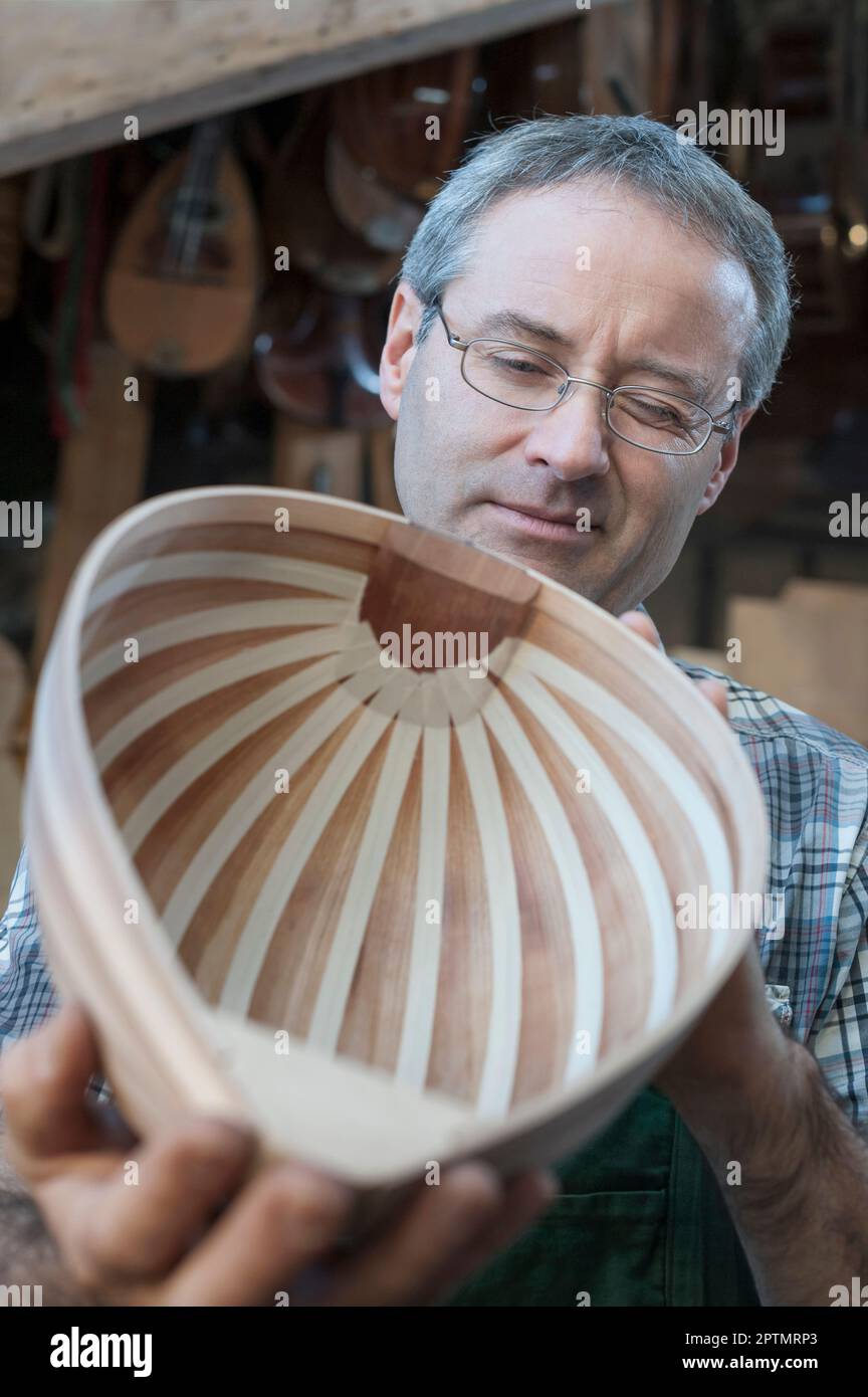 Craftsman manufacturing lute at Stock Photo Alamy