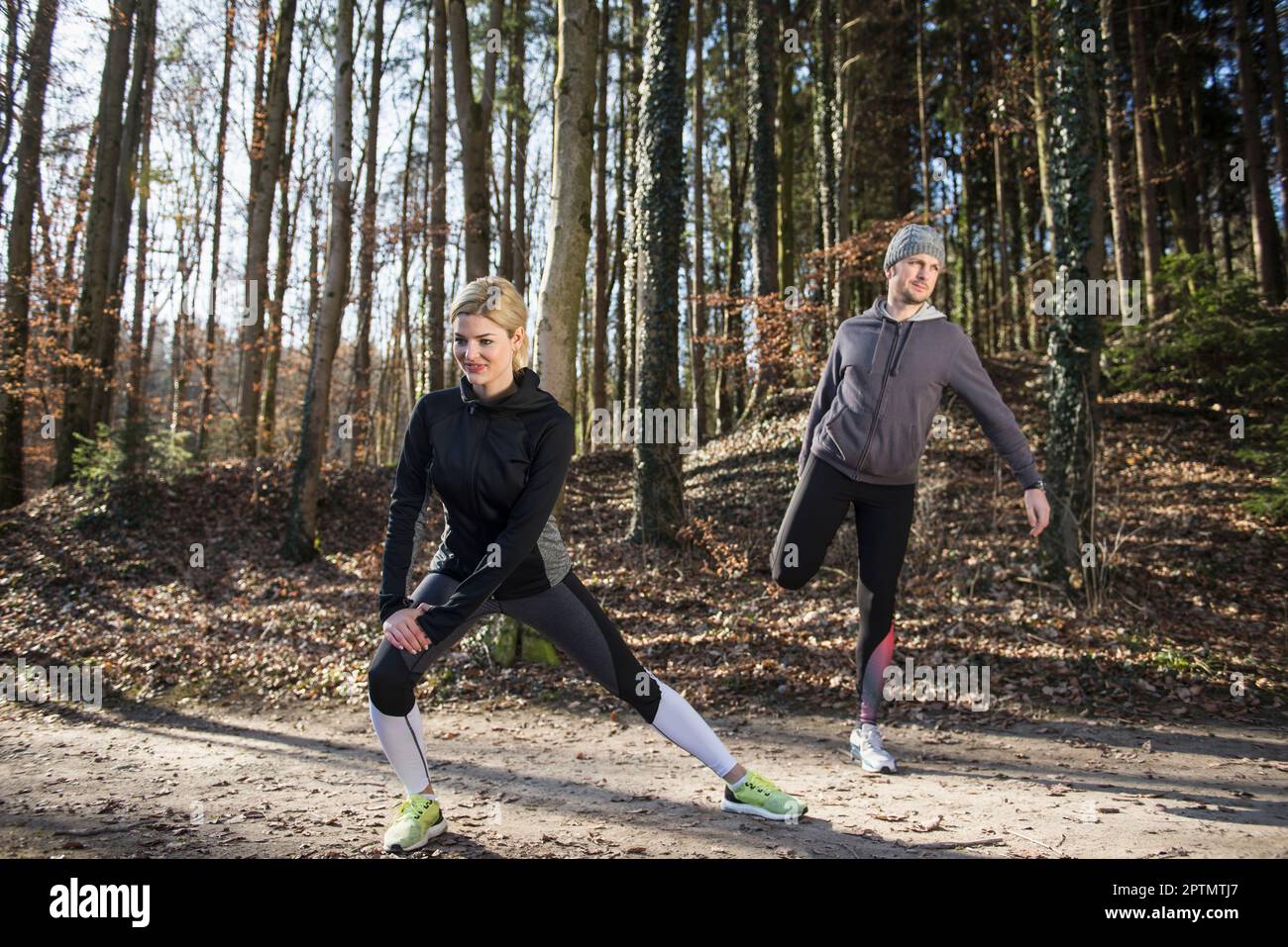 Females males doing stretching hi-res stock photography and images - Alamy