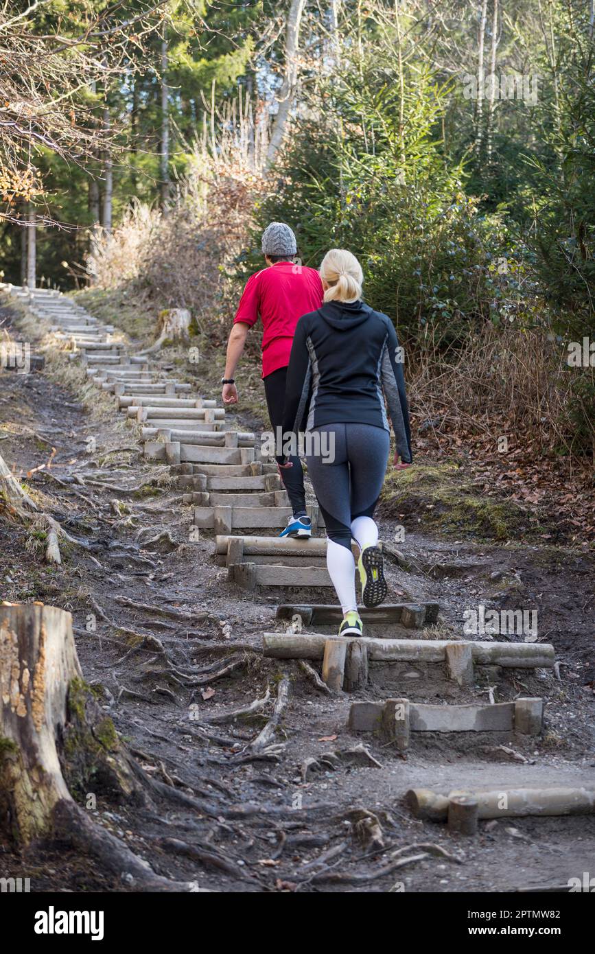 Couple doing training on stairs in nature Stock Photo