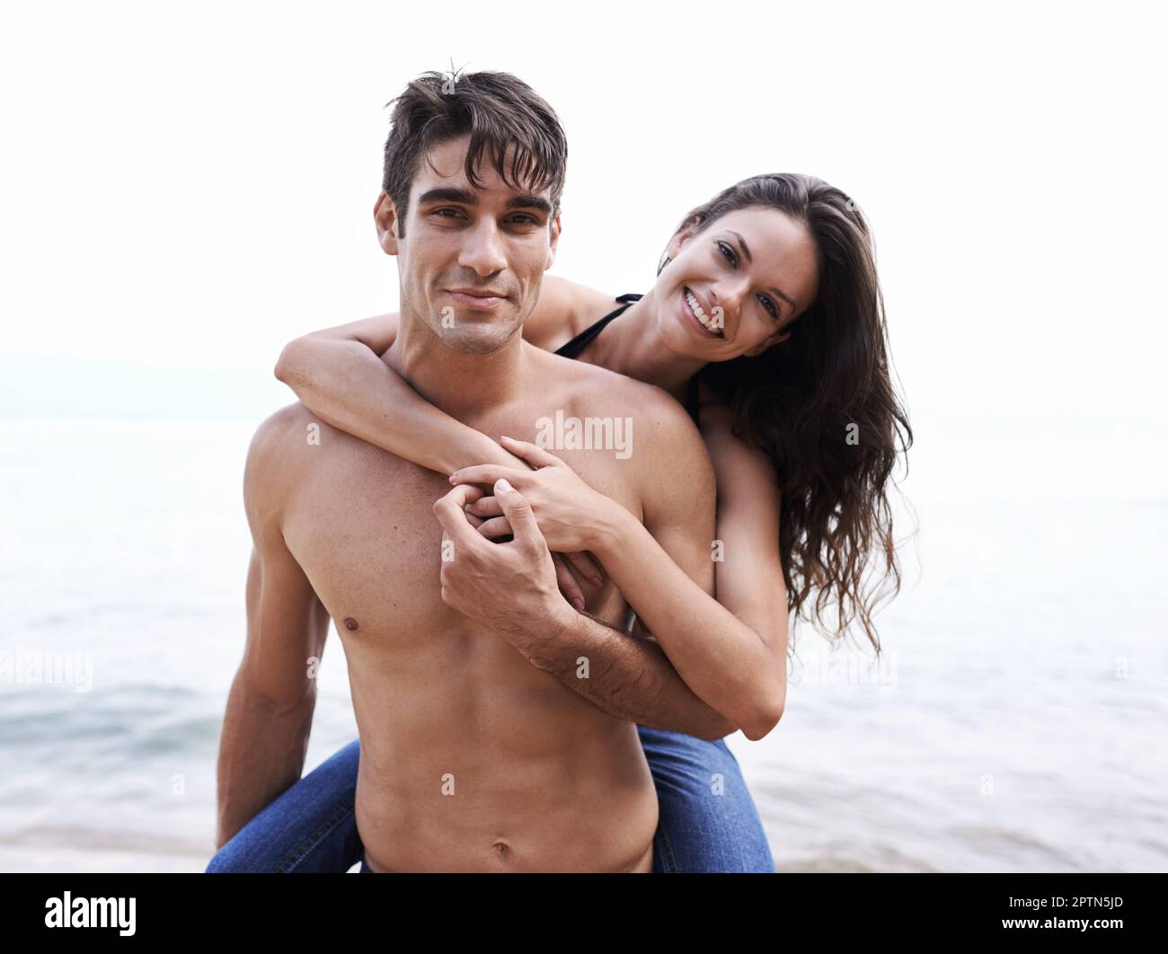 Midadult Caucasian Woman Giving Man Piggyback Stock Photo 3194063