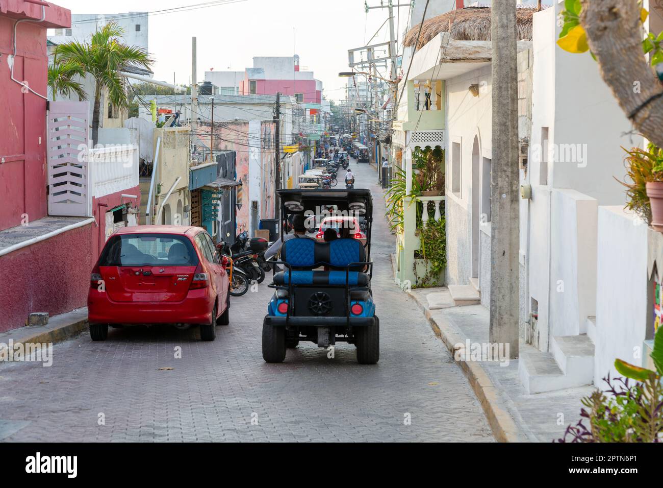 Golf cart vehicles in narrow street, Isla Mujeres, Caribbean Coast