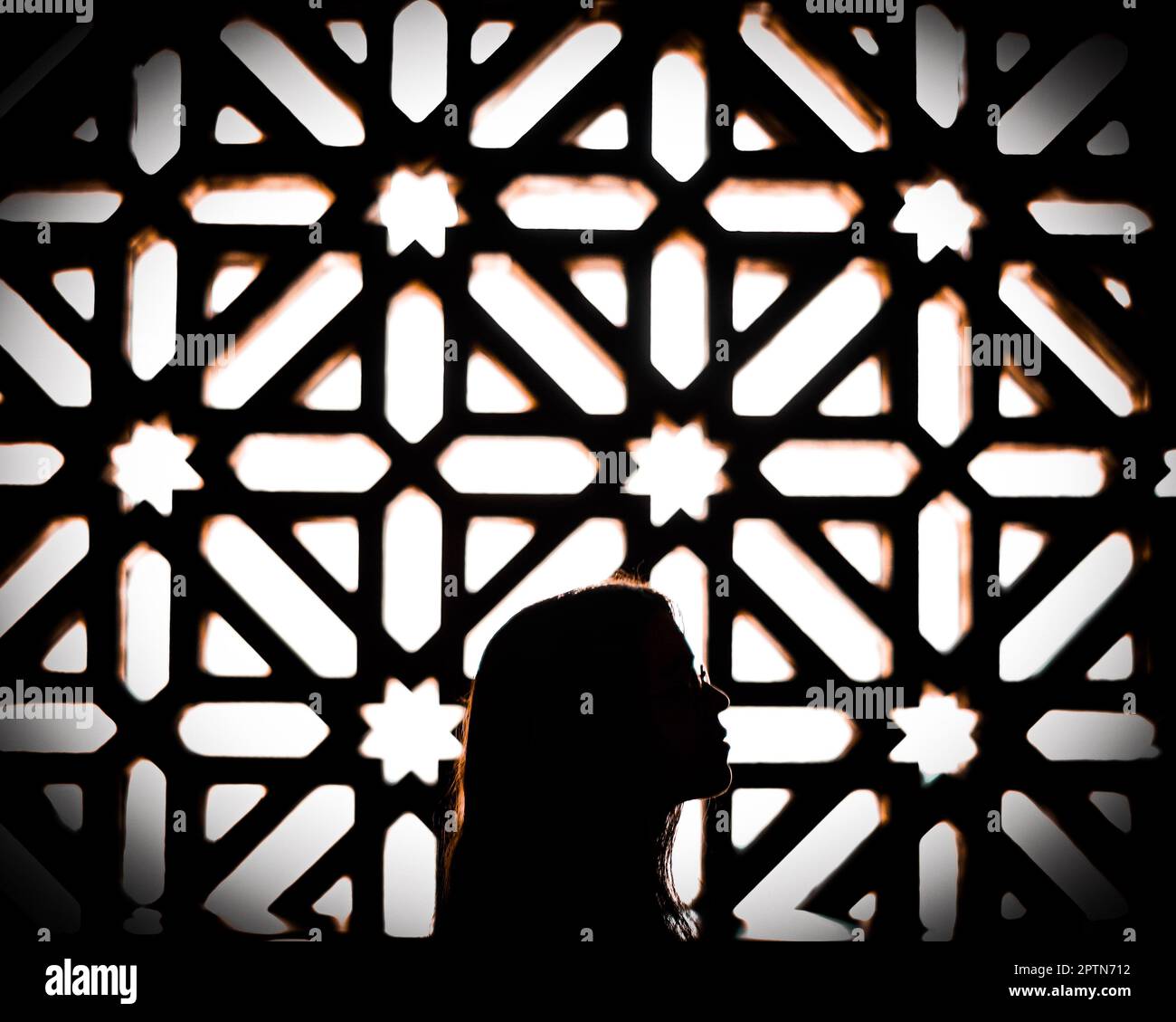profile girl in mosaic of shadow in mosque of Cordoba Stock Photo