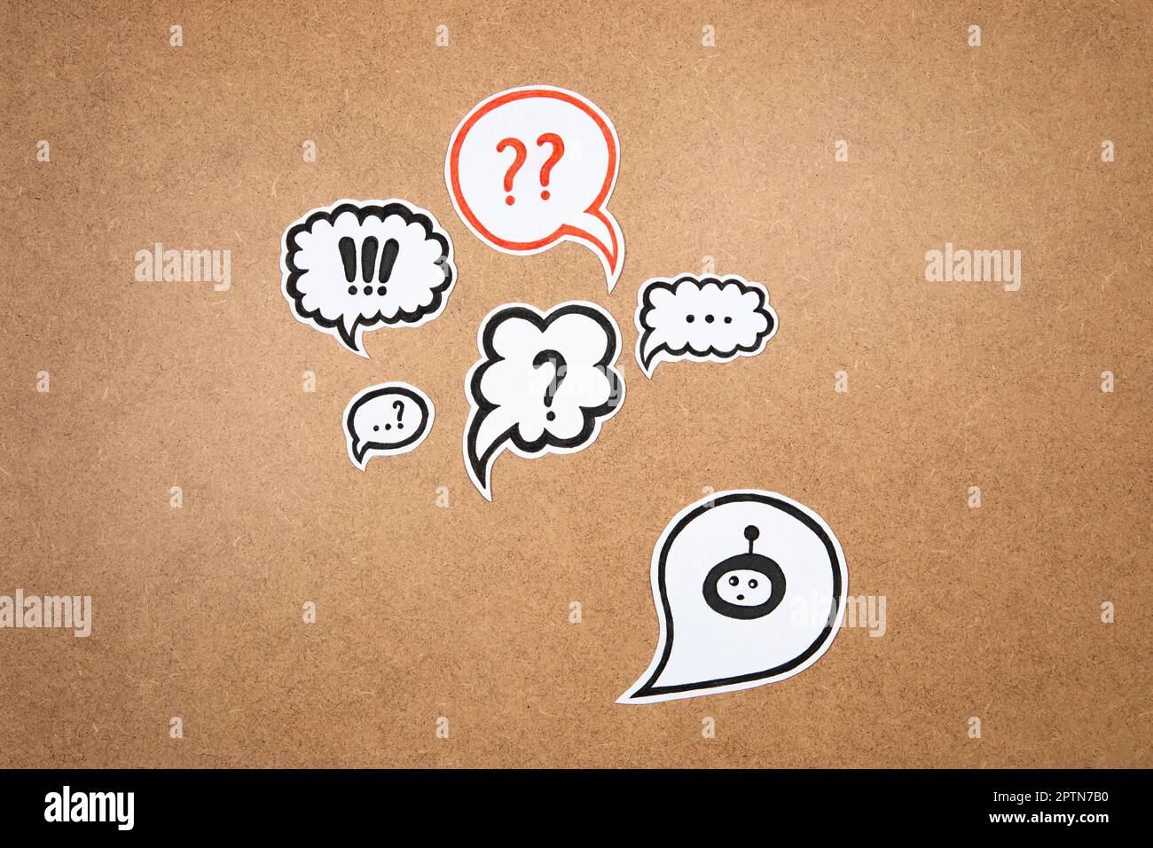 Bot with speech bubble, concept of chatting with bot. Asking question to AI. Question mark and bot representation ready to work. Chat GPT concept. Stock Photo