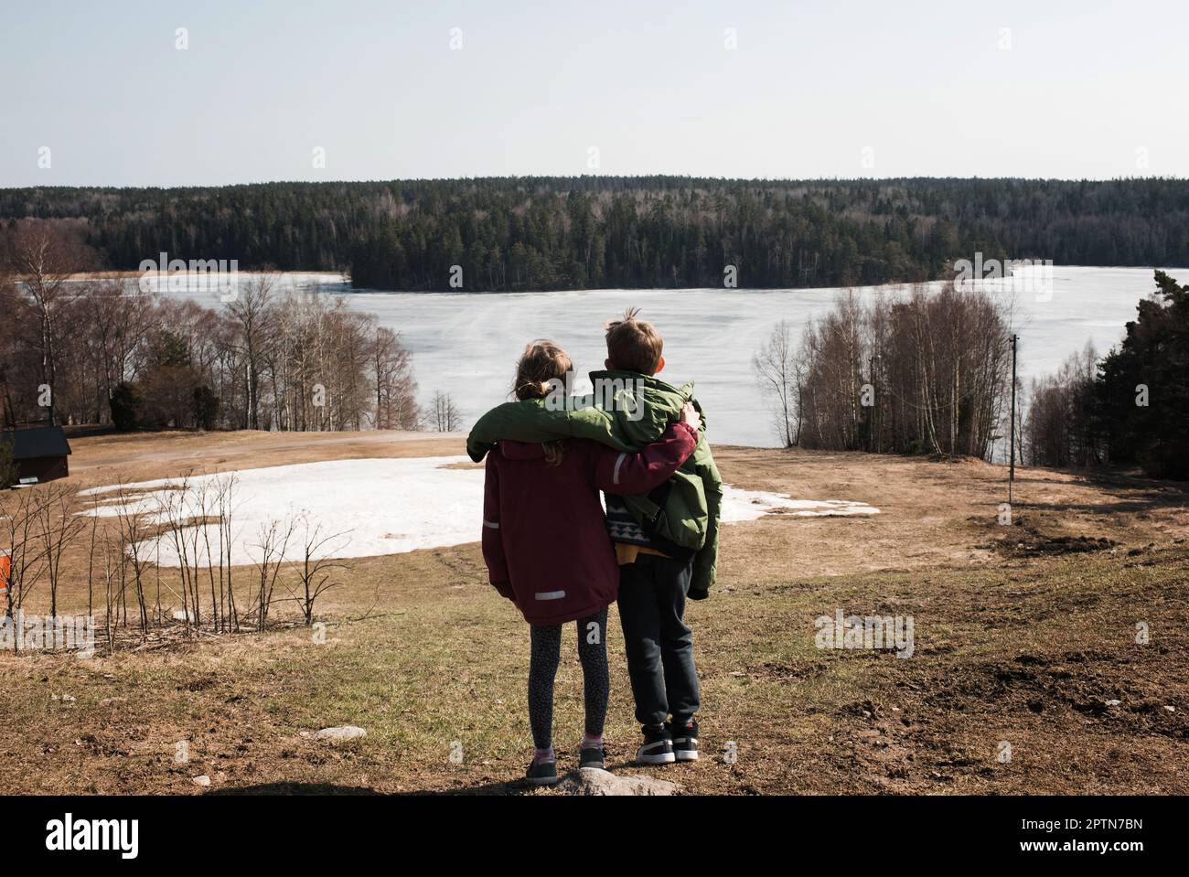 Brother and sister enjoying the beautiful lake view in Sweden Stock Photo Alamy