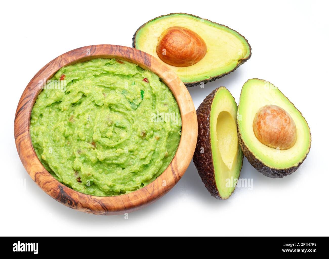 Guacamole and cross section of avocado fruits isolated on white