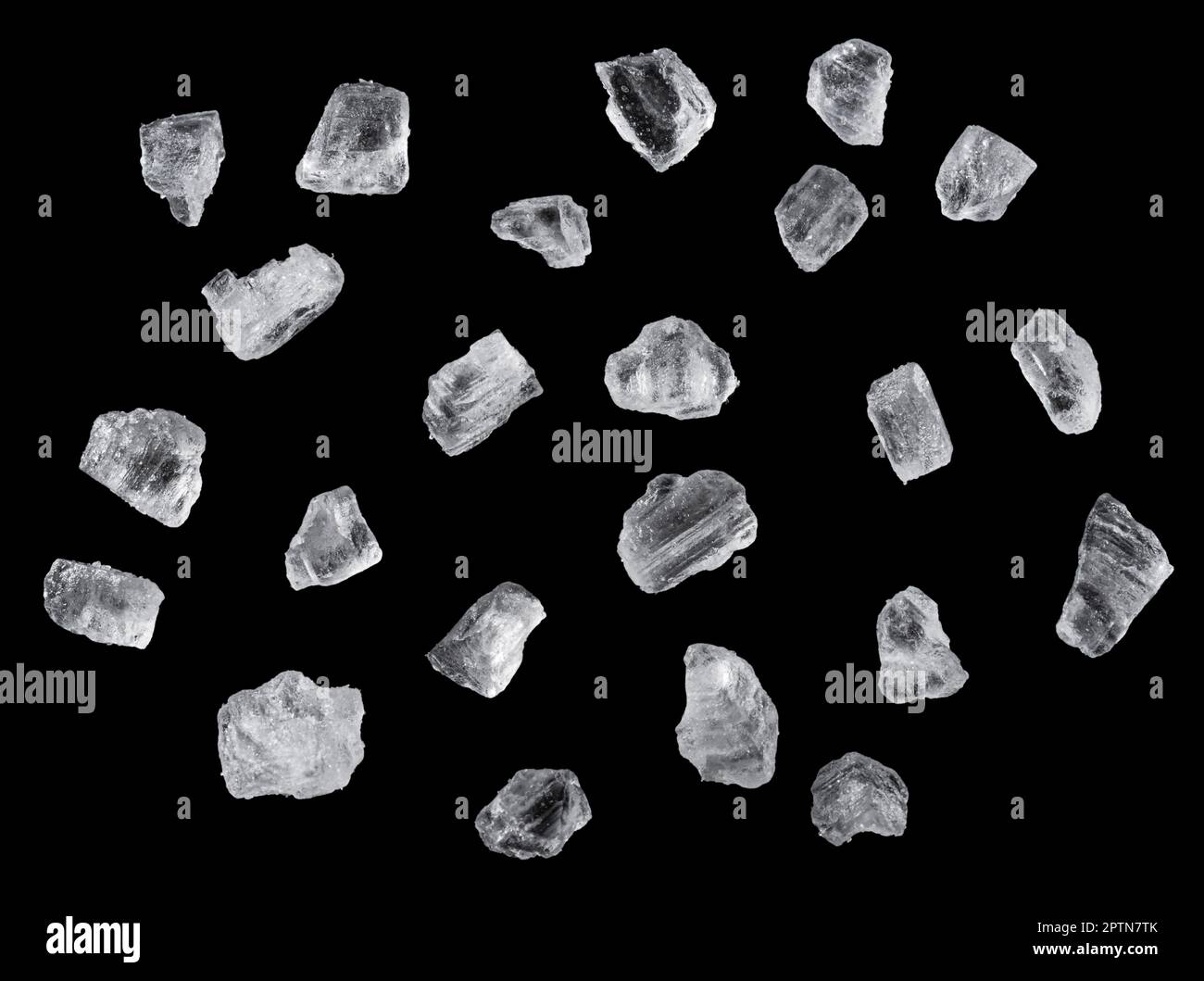 Salt crystals on black background. File contains clipping path Stock