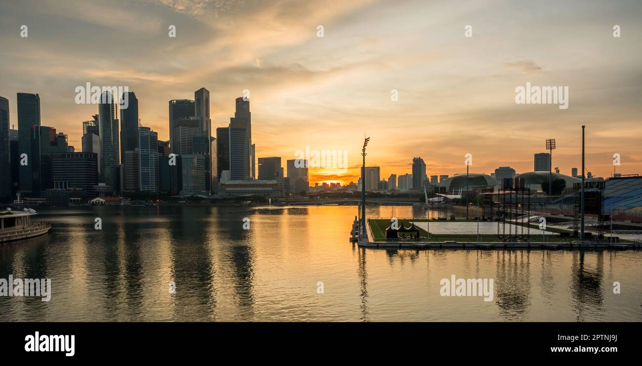 Landscape view of Singapore business district and city at twilight. Singapore cityscape at dusk building around Marina bay. Stock Photo