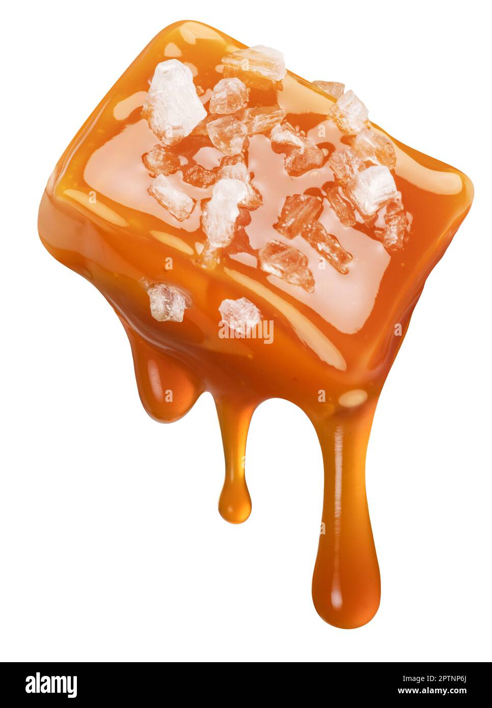 Salty caramel candy and drops of milk caramel sauce flowing down from