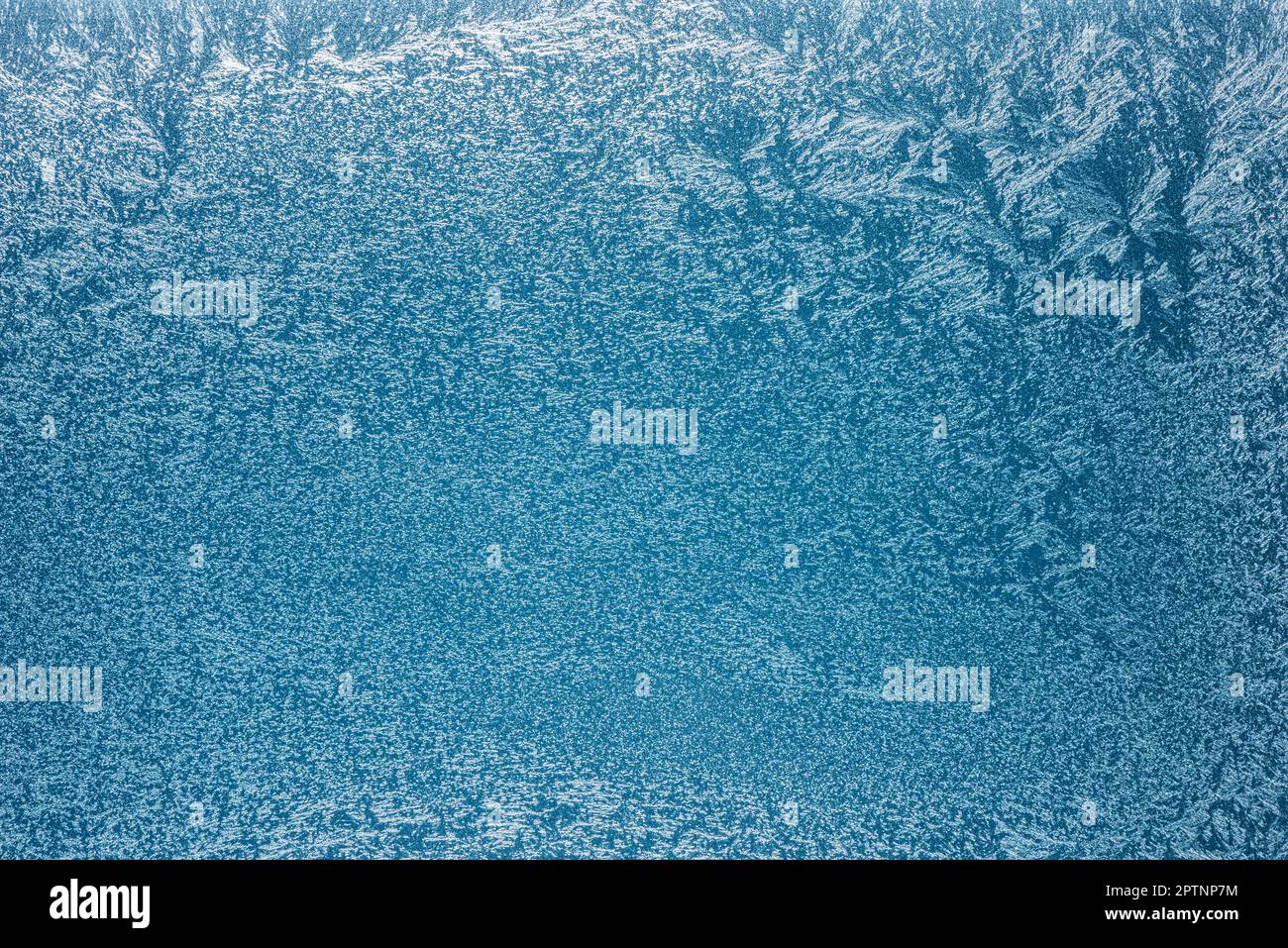 Frost patterns on frozen winter window as a symbol of Christmas wonder ...