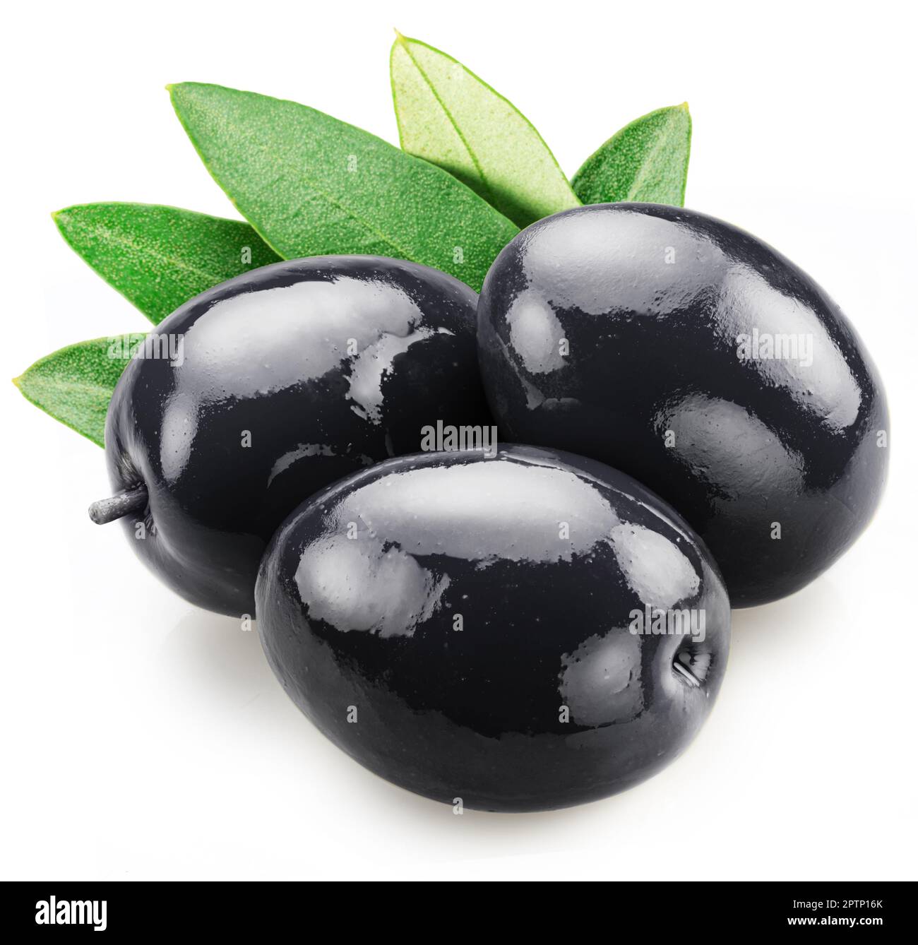 Three whole black olives with olive leaves isolated on white background