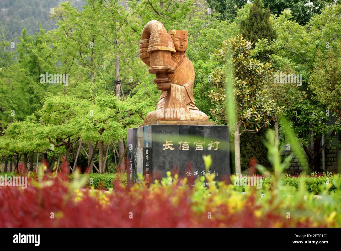 BAODING, CHINA - APRIL 28, 2023 - The 'Changxin Palace Lamp' themed sculpture of Han Dynasty tomb in Baoding city, Hebei province, China, April 28, 20 Stock Photo