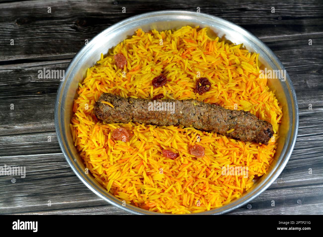 Arabic cuisine traditional food beef  Kofta, kebab and tarb kofta shish which is minced meat with Basmati rice and raisins, oriental grilled barbecued Stock Photo