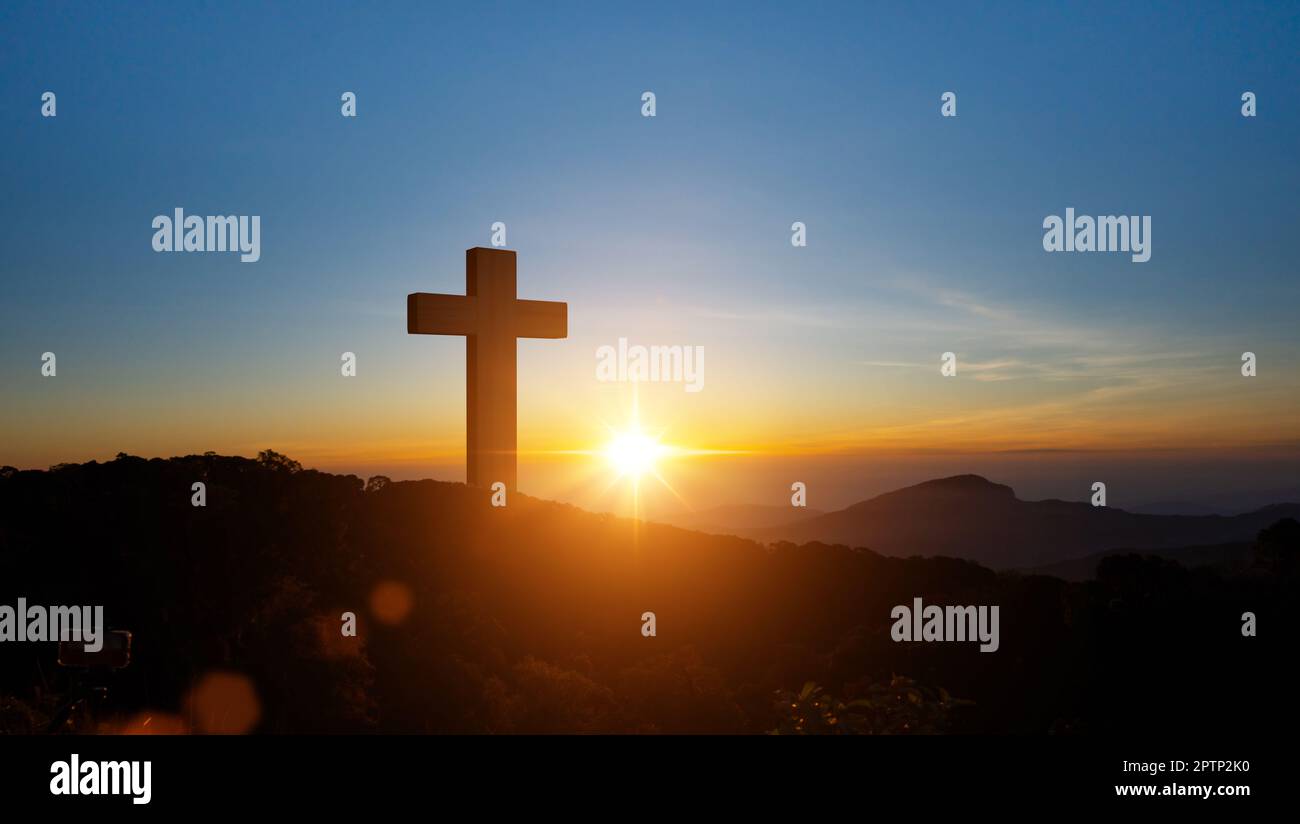 Silhouettes Of Christian Cross Symbol On Top Mountain At Sunrise Sky