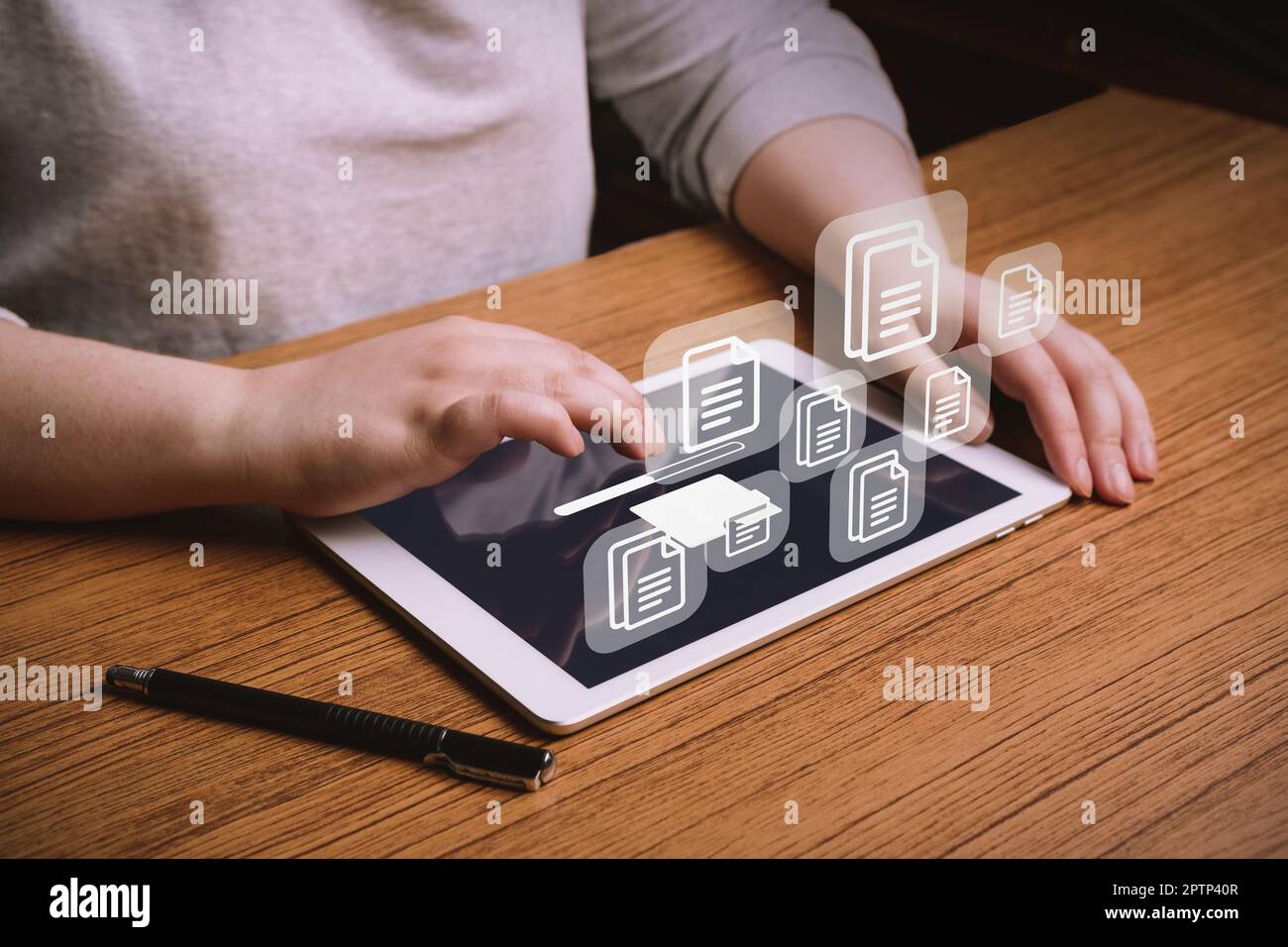 Woman working on laptop to Document Management System (DMS). Software
