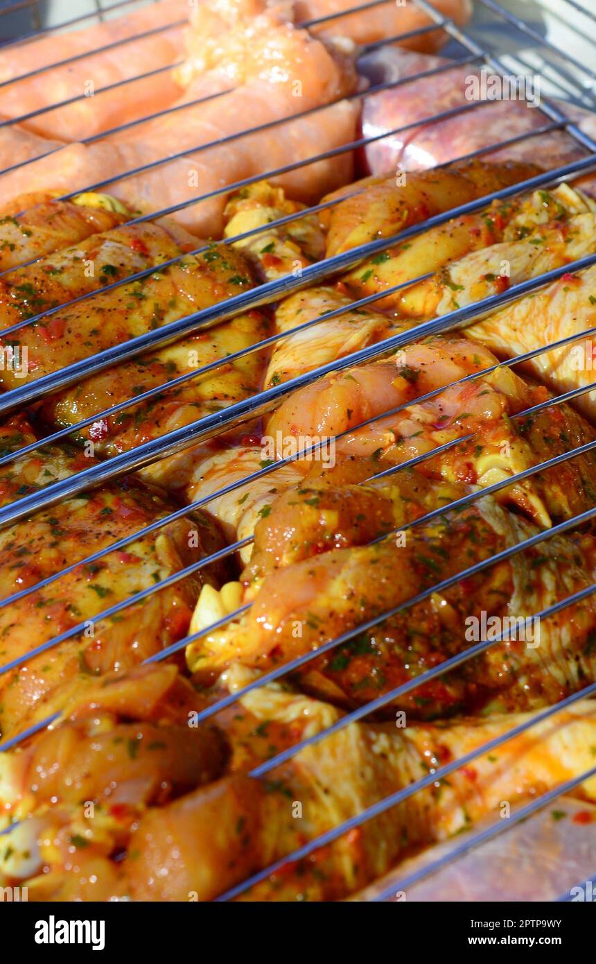Delicious chicken legs on garden grill. Marinated Chicken Legs On The