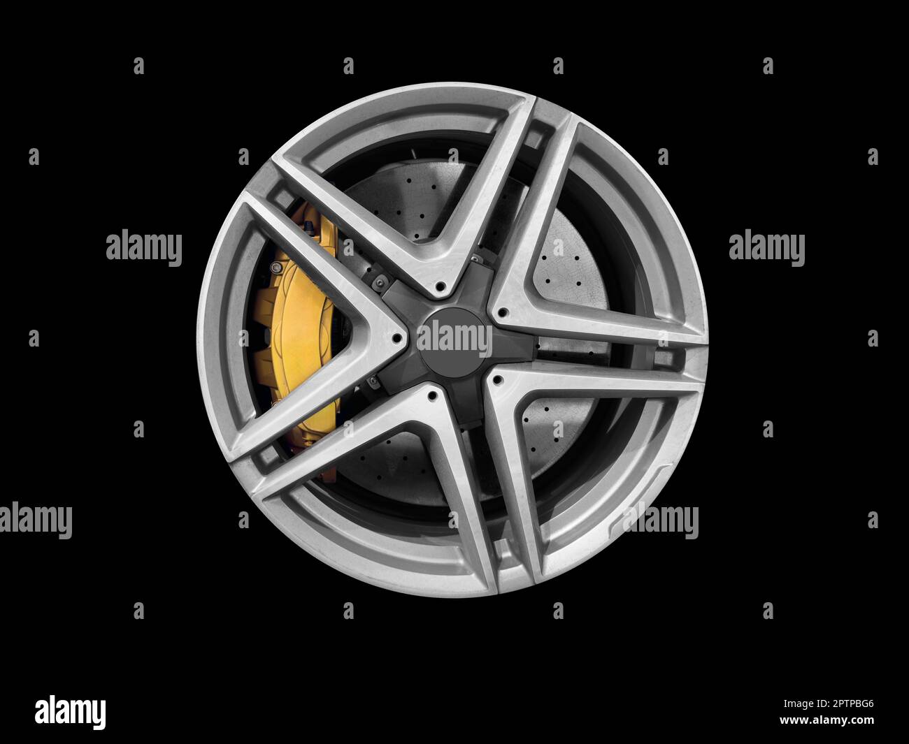 Car alloy wheel and tyre isolated on black background. New alloy wheel