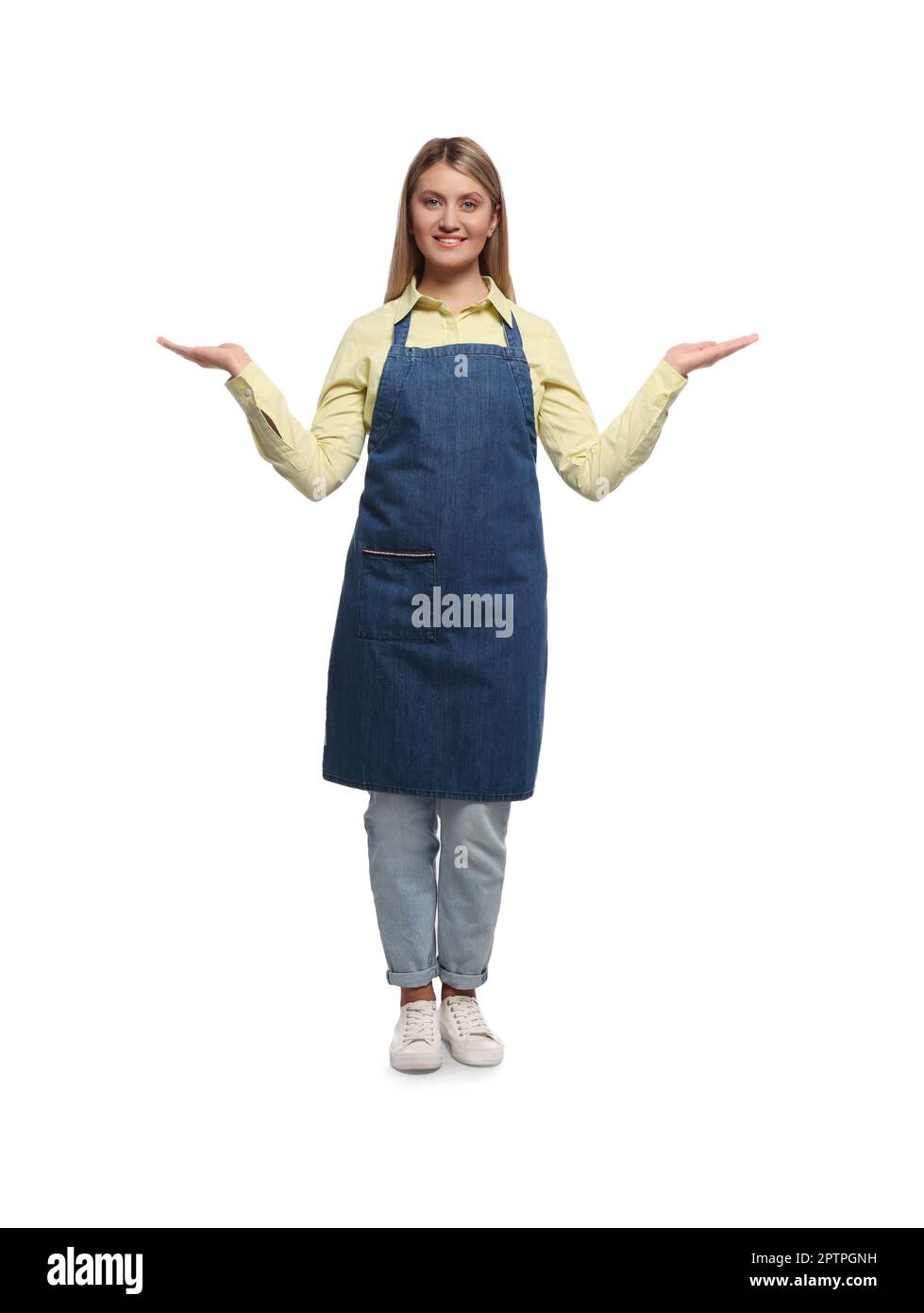 Beautiful young woman in denim apron on white background Stock Photo ...