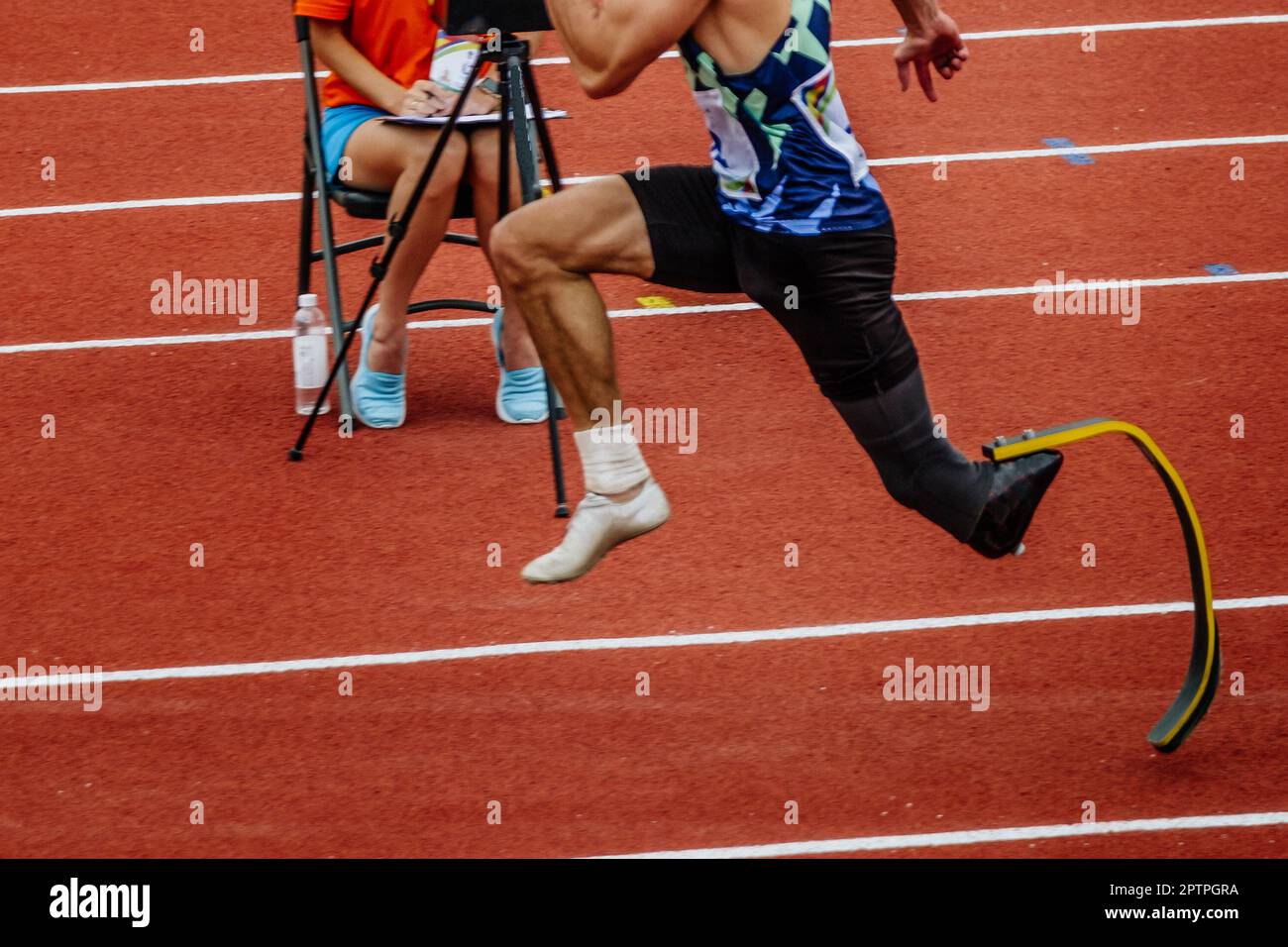 male para athlete on limb deficiency run up in long jump, summer para athletics championships Stock Photo
